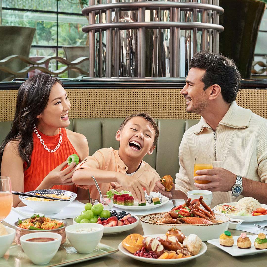 A family of three enjoying a meal from RISE's exclusive 2024 Mother's Day menu