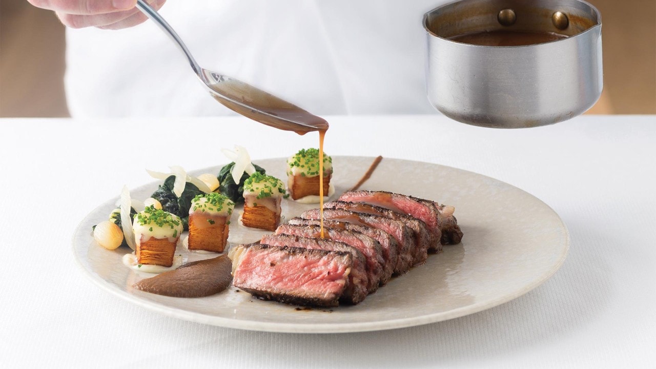 Sauce over steak at Spago Dining Room, the best western restaurant in Singapore