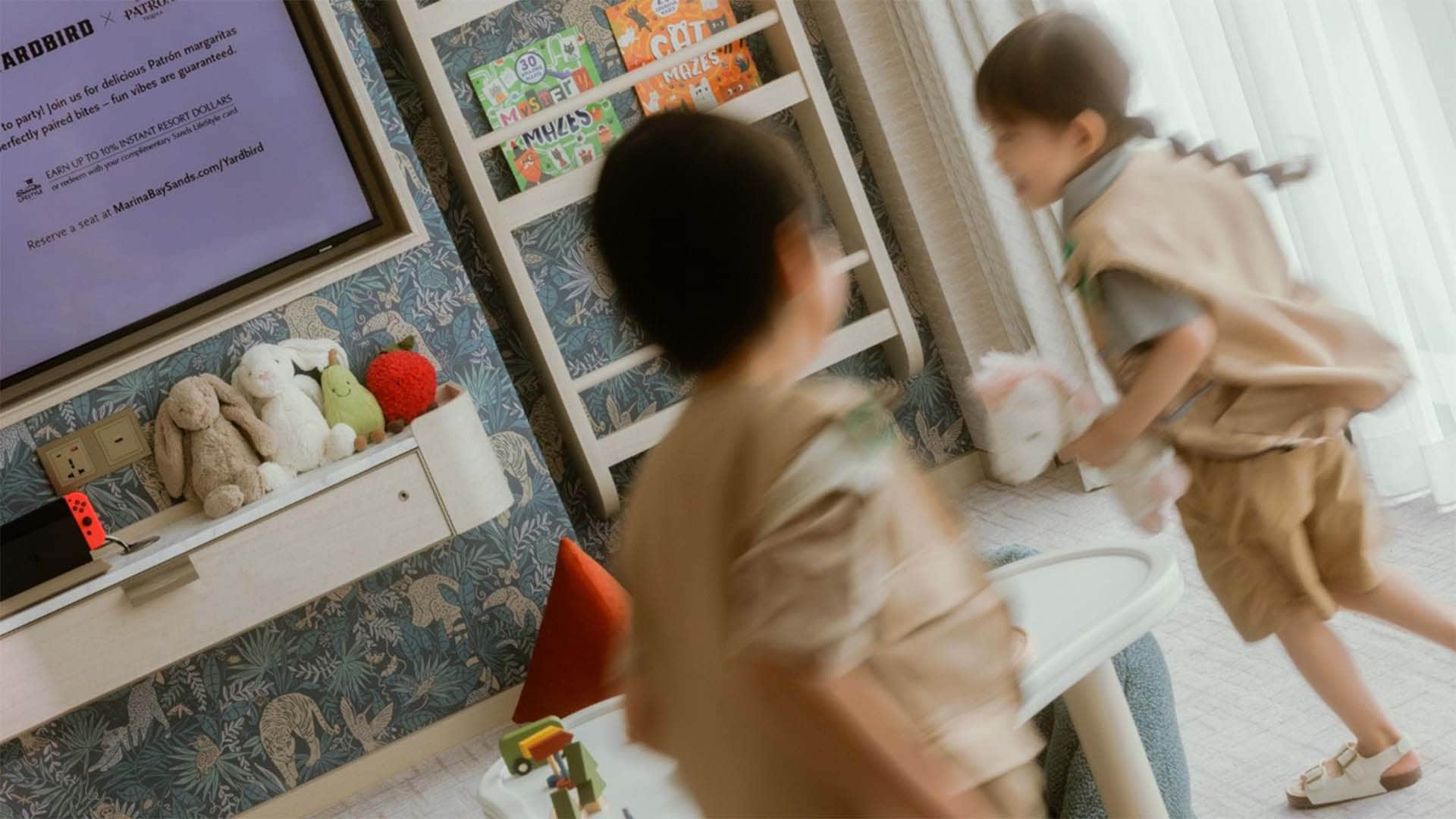 Children playing in a kids-friendly hotel room in Singapore