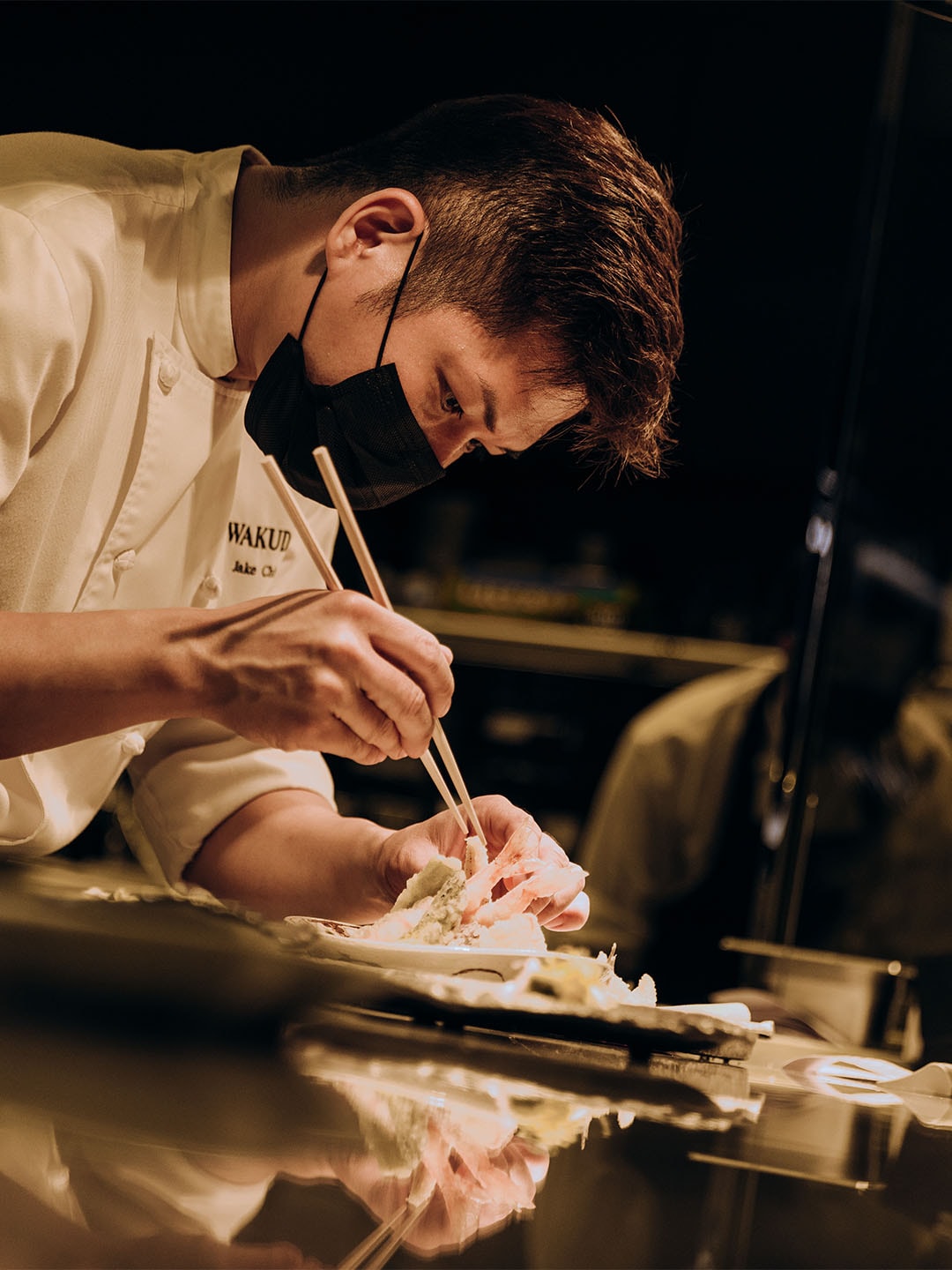 Chef making a sushi for omakase dining in Singapore