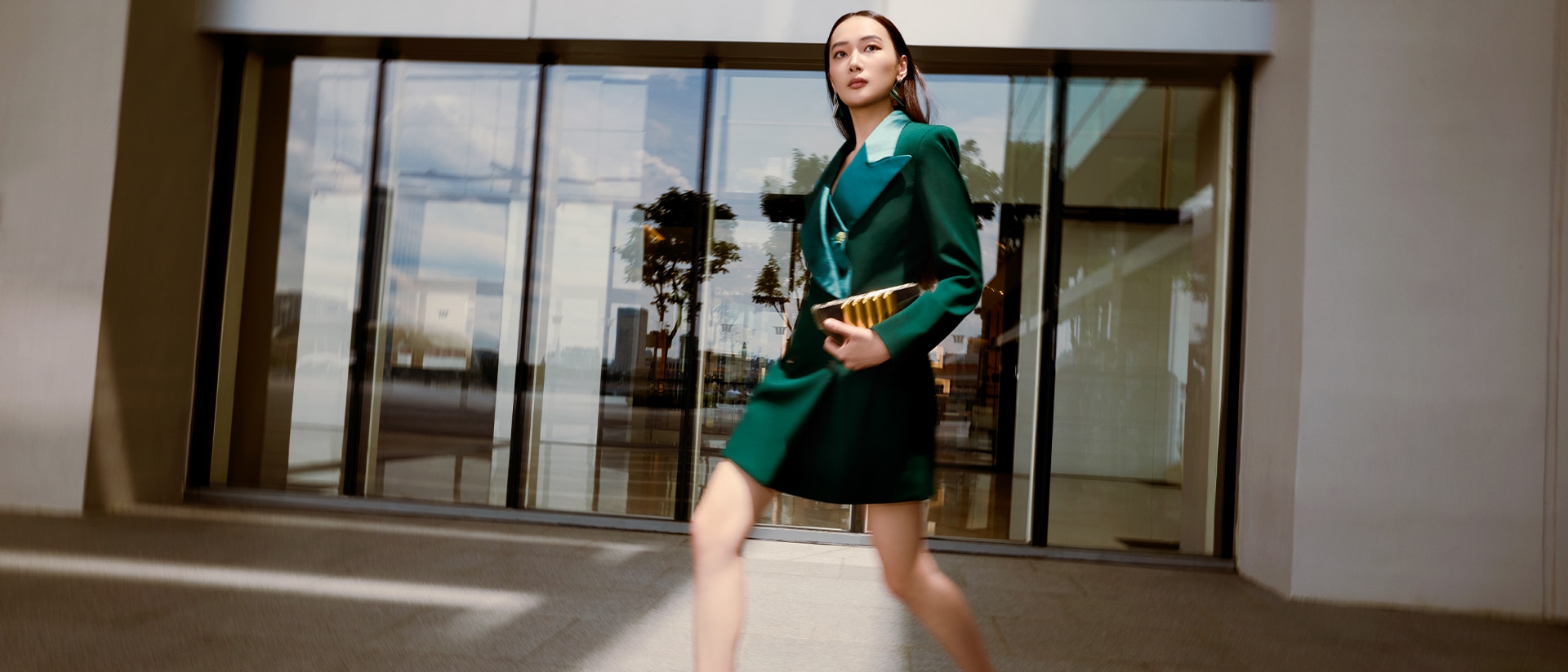 Woman walking along The Shoppes at Marina Bay Sands, shopping for top luxury fashion brands in Singapore