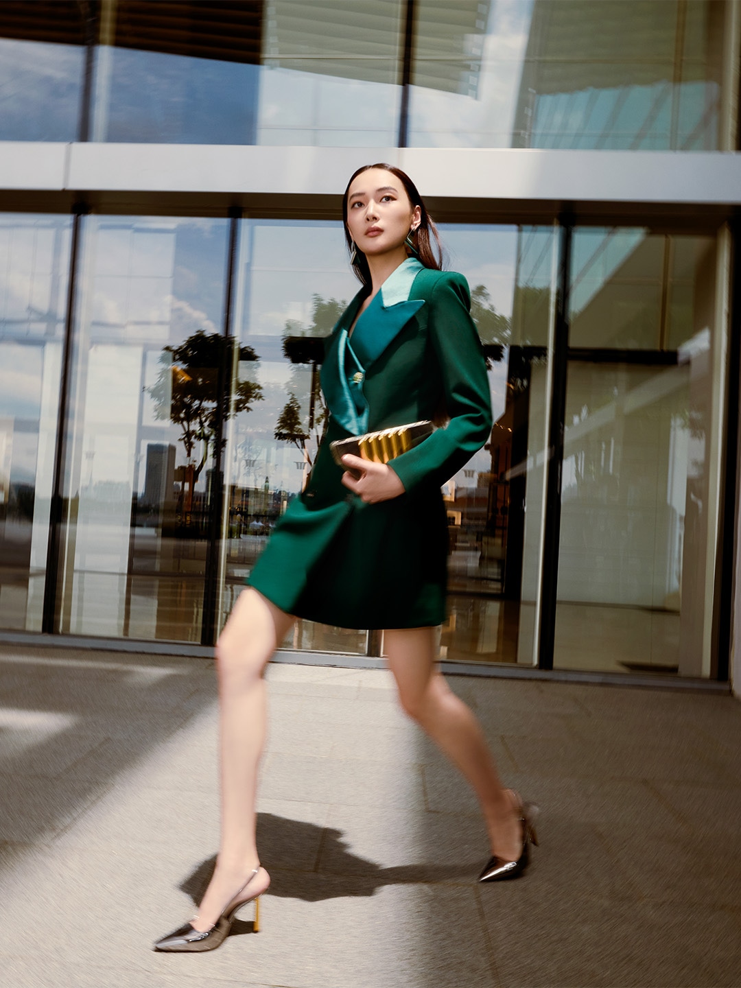 Woman walking along The Shoppes at Marina Bay Sands, shopping for top luxury fashion brands in Singapore