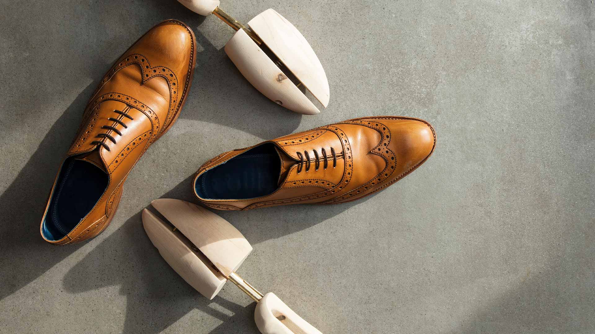 Shoe tree and a pair of men's brown leather shoes from top shoe brand in Singapore