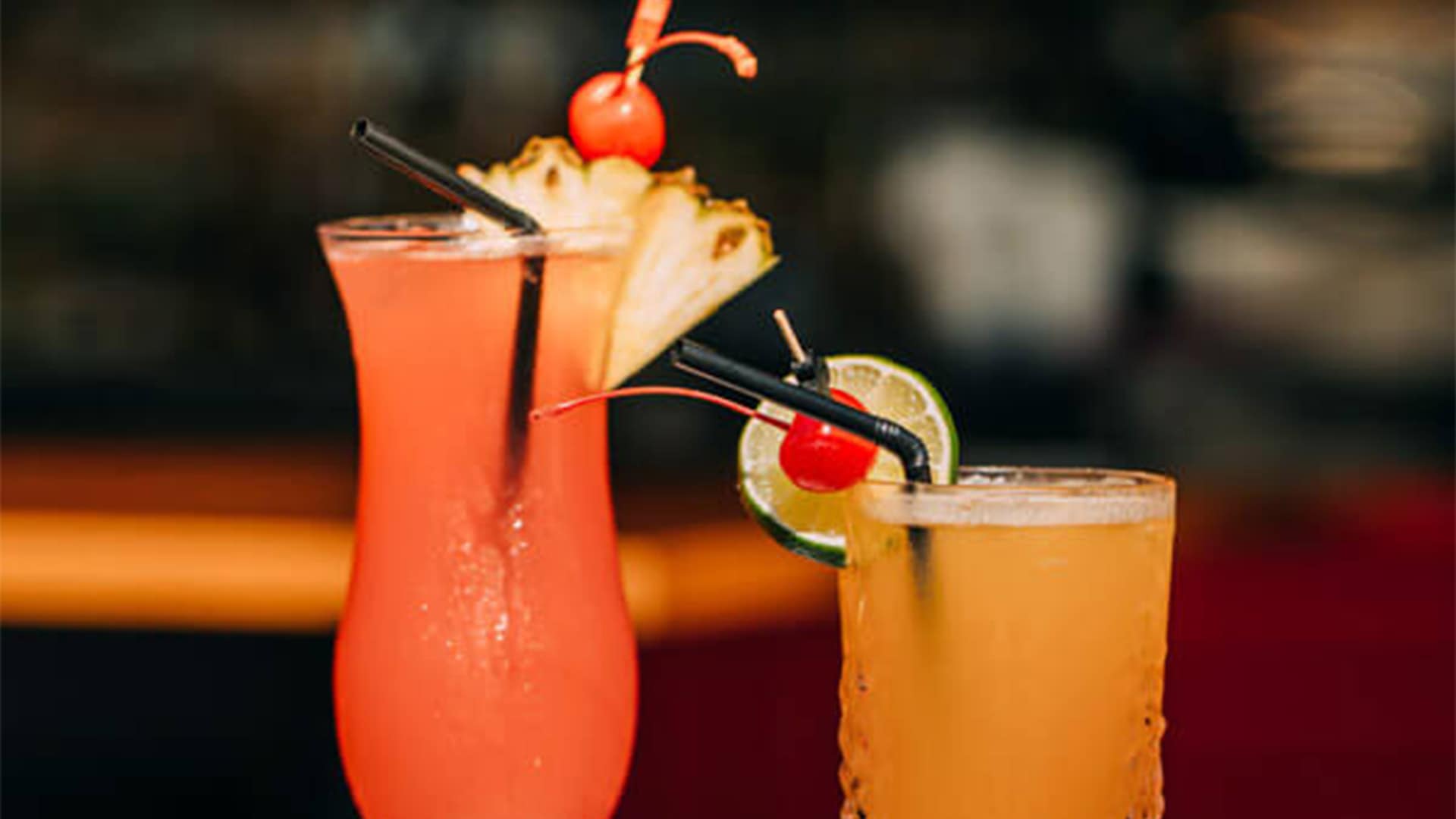 A glass of crimson red Singapore Sling cocktail at Dallas Cafe & Bar at Marina Bay Sands