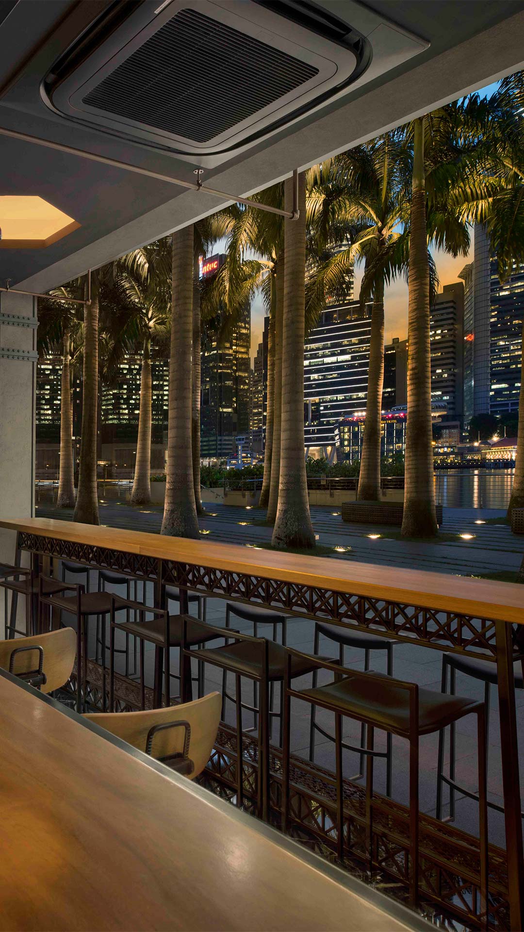 Bar area facing the Marina Bay waterfront promenade at the best waterfront bars in Singapore