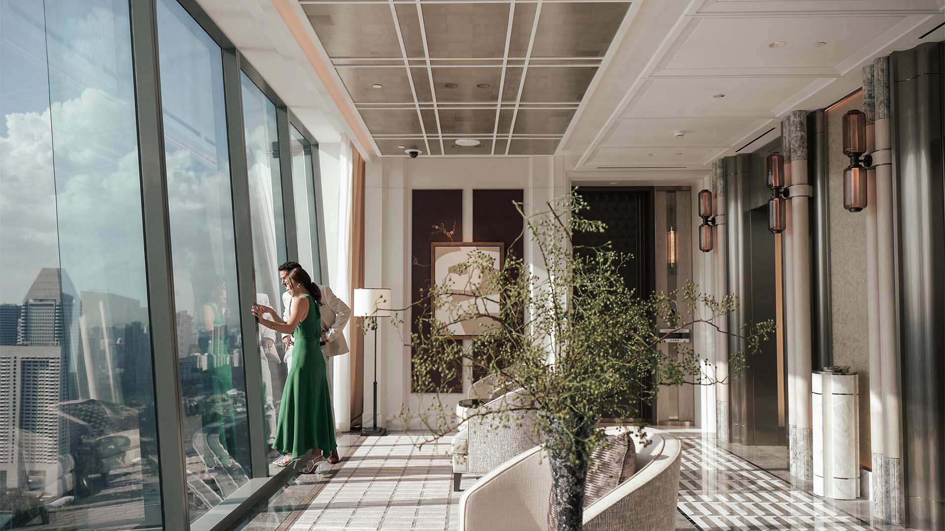 Couple at Marina Bay Sands for a Valentine's Day staycation, looking at the city view 