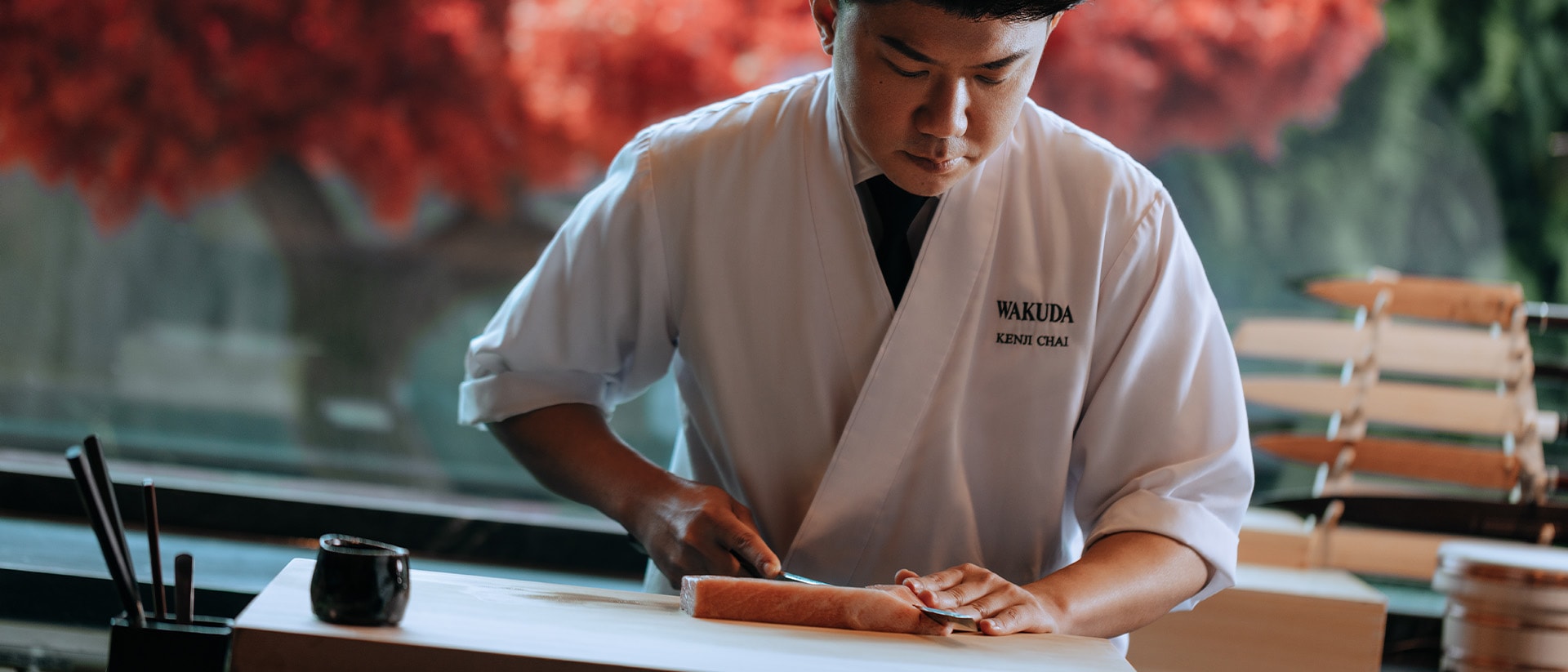 Chef from a Japanese restaurant in Singapore, preparing the perfect sashimi