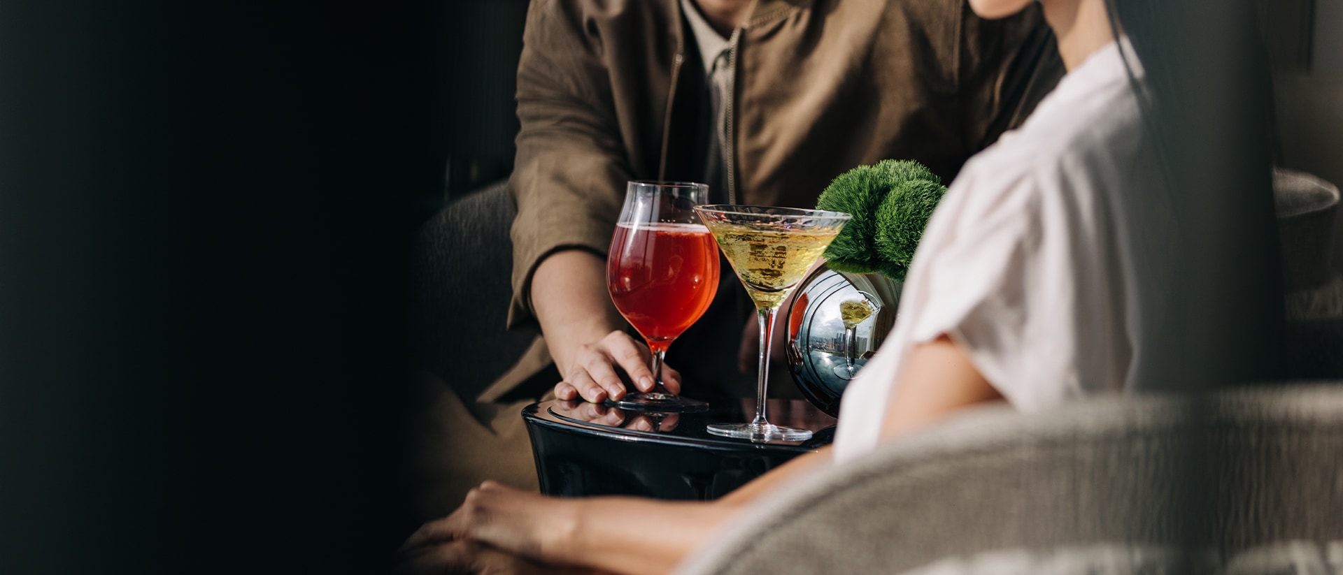 Couple enjoying cocktails at a romantic restaurant in Singapore