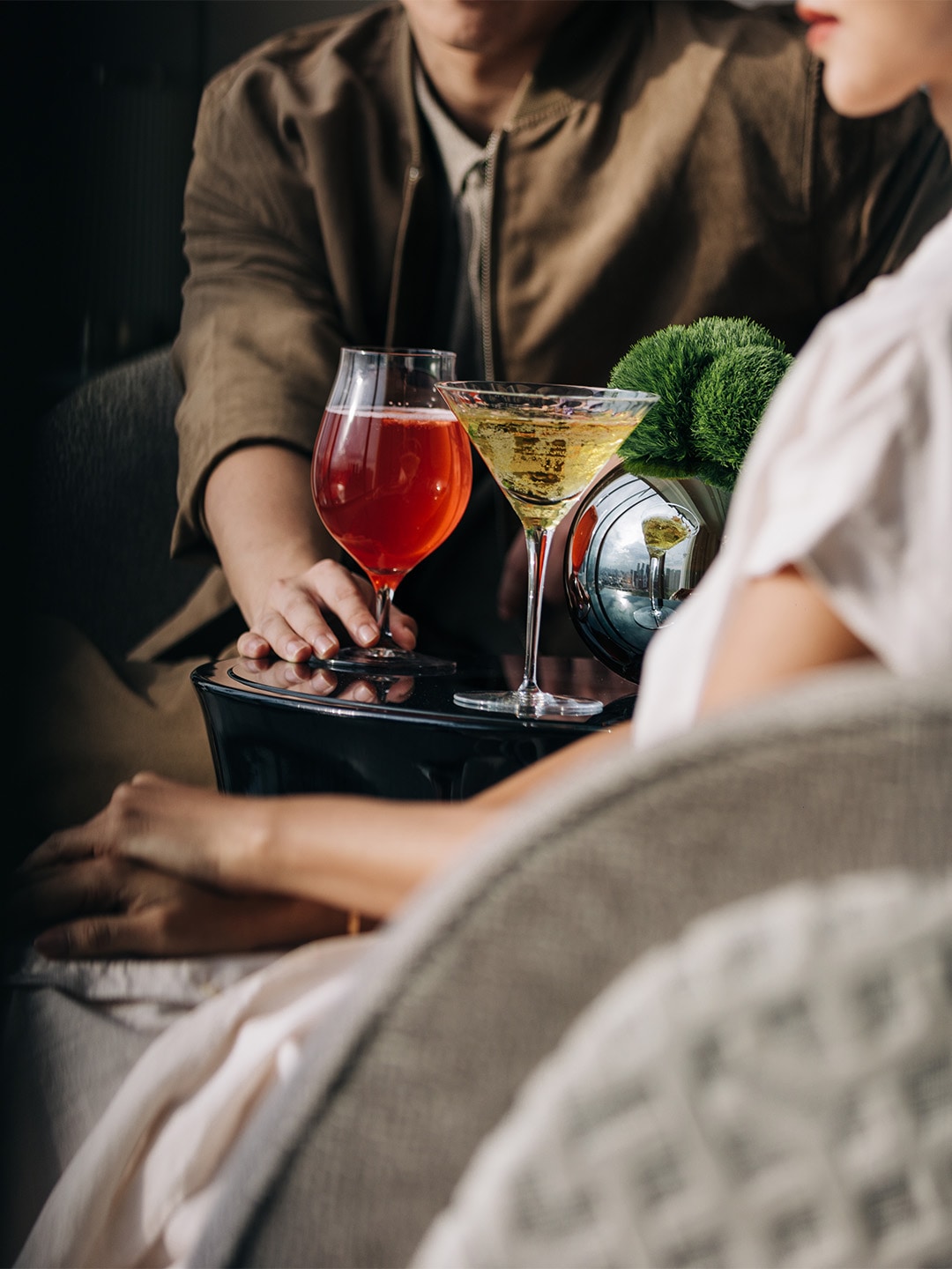 Couple enjoying cocktails at a romantic restaurant in Singapore