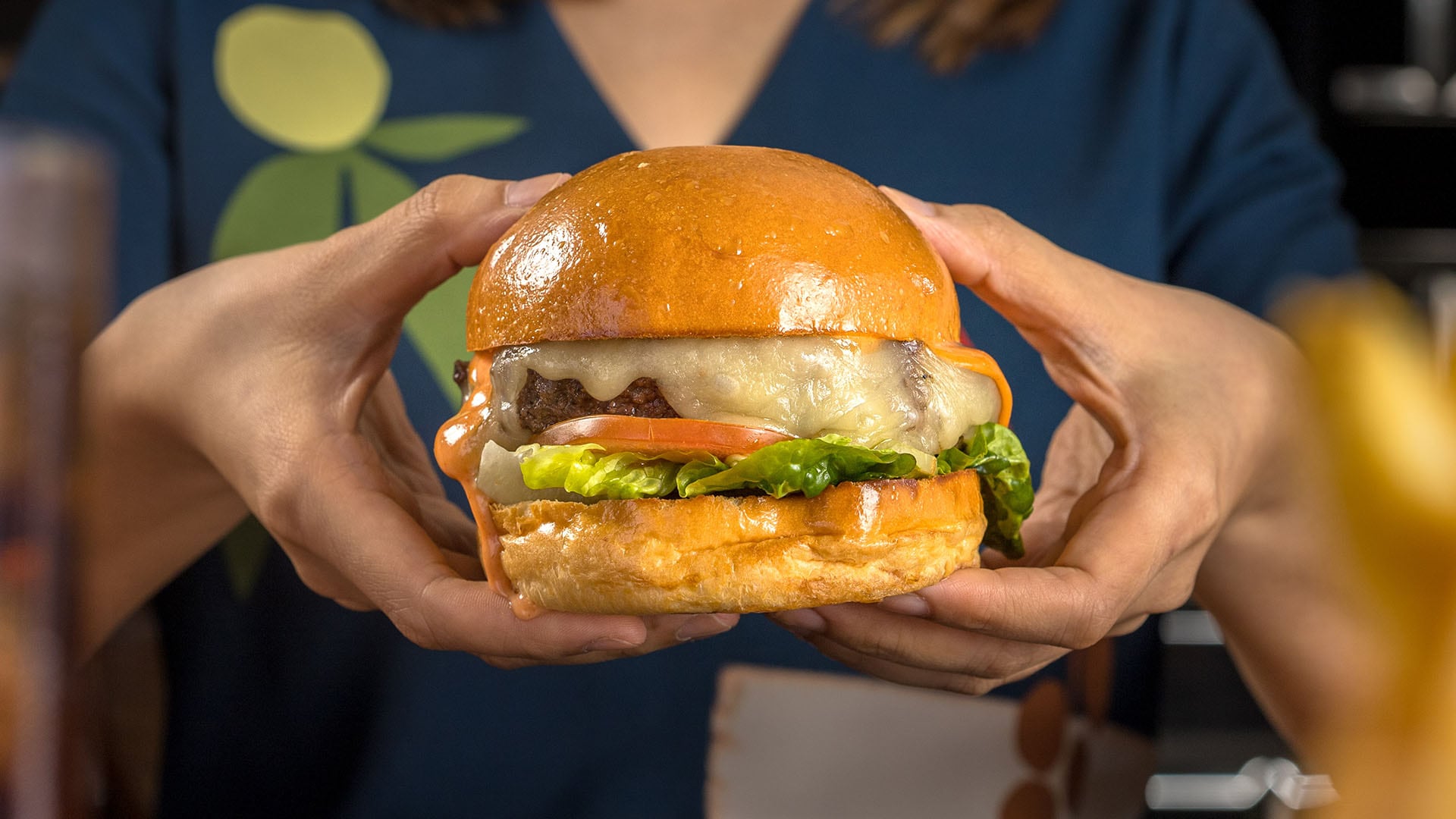 DRY-AGED BEEF BURGER WITH MONTEREY JACK CHEESE AND SRIRACHA MAYO