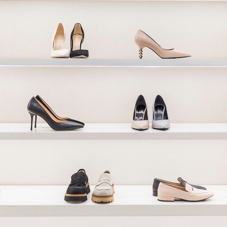 Variety of women heels from a luxury shoe brand in Singapore, arranged on a shelf for display